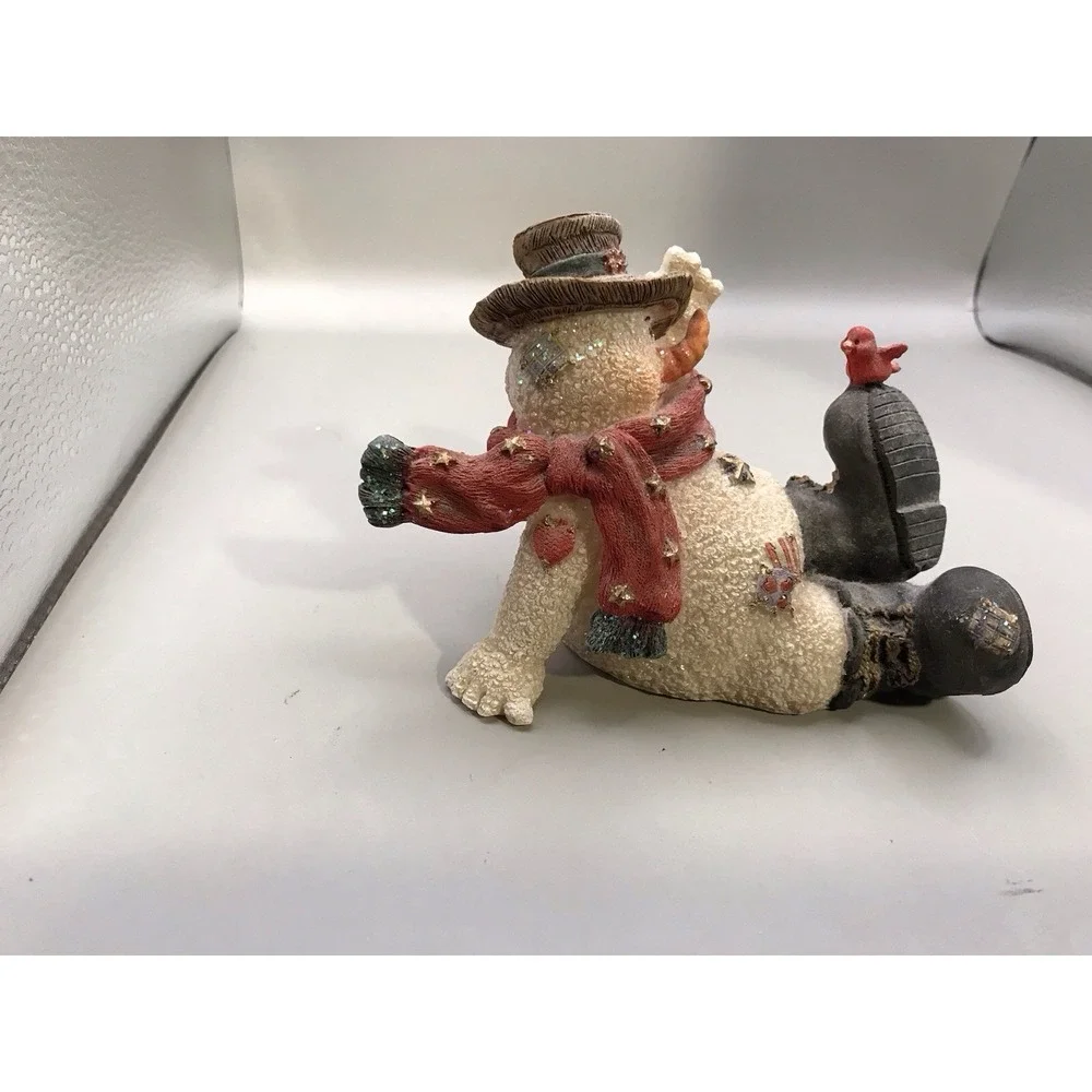 Resin Snowman Kicked‎ Back With A Bird On His Foot